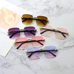 Group display of five rimless diamond-cut sunglasses in gradient colors with gold metal joints