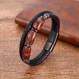 Braided black leather bracelet with red-brown stone beads and a black magnetic buckle
