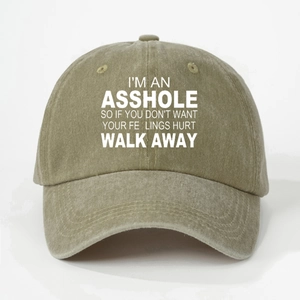 Detail of vintage washed khaki baseball cap with white ASSHOLE printed text slogan