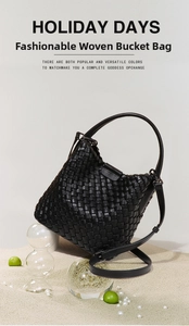 Detailed view of black woven leather bucket bag with magnetic closure and crossbody strap
