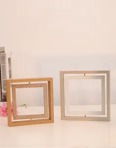 Detail of creative double-sided rotating wooden photo frame showing 360-degree rotation axis