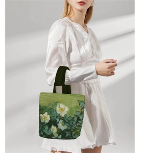 Detail of Van Gogh inspired floral canvas bucket bag featuring white almond blossoms