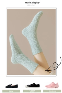 Detail of soft mint green coral fleece socks showing thick plush texture and warm fit