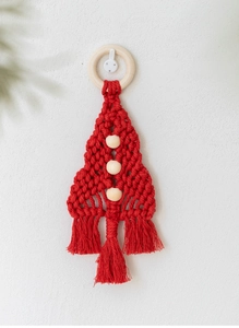 Detailed view of handmade red macrame Christmas tree wall hanging with wooden beads