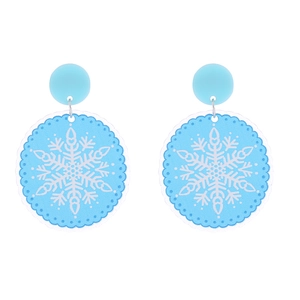 Detailed macro view of light blue acrylic snowflake earrings with glitter finish