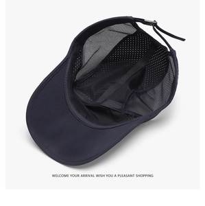 Detail view of the breathable honeycomb mesh interior and adjustable strap of the baseball cap