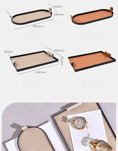 Detail of woven leather organizer tray with metal handles and precise size dimensions