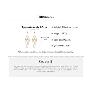 Detailed view of rhinestone tassel earrings showing dimensions and silver needle material