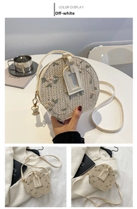 Detail of cream-colored woven round bag with floral embroidery and vegan leather straps