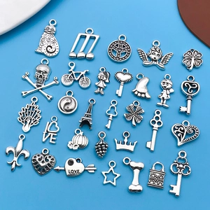 Collection of 30 silver alloy charms for DIY jewelry making including hearts and keys