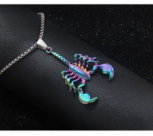 Macro shot of hip hop scorpion pendant with colorful plating and silver box chain on leather
