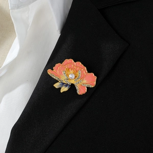 Pink enamel peony flower brooch with pearls and diamonds on a black suit lapel