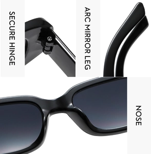 Detail view of secure hinges, curved legs and nose pads on black rectangle sunglasses