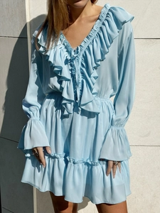 Detailed view of V-neckline with ruffles and drawstring on sky blue chiffon dress
