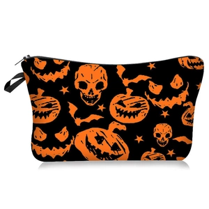 Detail of Halloween cosmetic bag with orange pumpkin, skull, and bat prints on black fabric