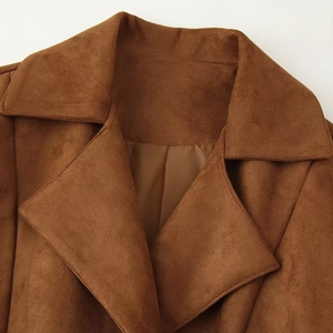 Close-up of brown faux suede jacket lapel showing premium matte fabric texture