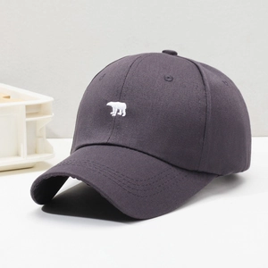 Charcoal grey cotton baseball cap with polar bear embroidery in a 45-degree side view