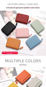 Colorful lychee grain leather card holders with secure metal zippers on a magazine