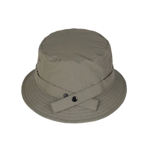 Olive green nylon bucket hat with decorative strap and metal snap buttons for outdoor wear