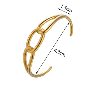 Bracelet jonc ouvert en métal doré au design géométrique moderne, pesant 19,5 grammes