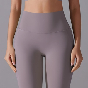 Close-up of high-waist yoga leggings showing matte texture and seamless stitching