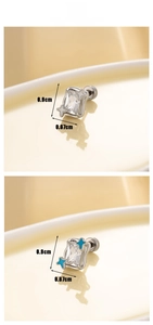 Detail view of star-accented geometric earrings with dimensions and rectangle zircon