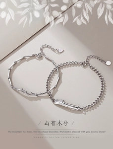 Detailed view of S925 sterling silver couple bracelets with bamboo and branch link designs