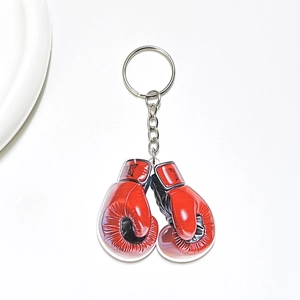 Close-up of red boxing gloves illustration on transparent acrylic keychain charm