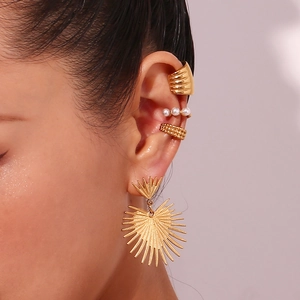 Gold plated cactus heart earring and pearl ear cuff set shown on female model