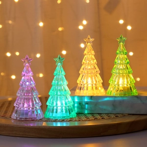 Luminous crystal mini Christmas trees in four colors on a tiered decorative stand