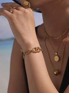 Detailed view of 18k gold plated chain bracelet with sparkling zircon circular charms