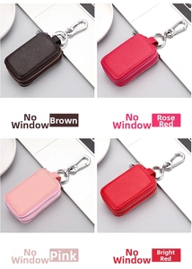 Detail of four-color double-zipper leather key cases with lychee texture and metal hooks