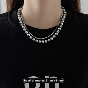 Detail of silver dual-layer ball chain necklace with 3mm and 8mm bead size measurements