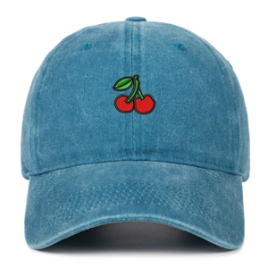 Close-up of fine cherry embroidery on blue washed cotton twill baseball cap fabric
