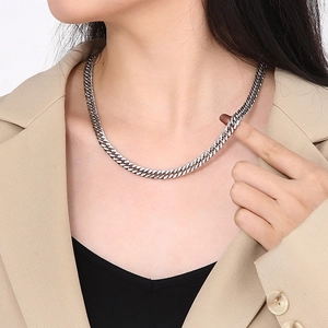 Silver chunky Cuban link chain necklace on model showing metallic luster and hip hop style