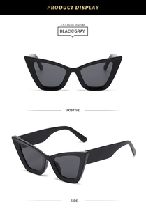 Detailed front and side views of oversized black cat-eye sunglasses with gray lenses