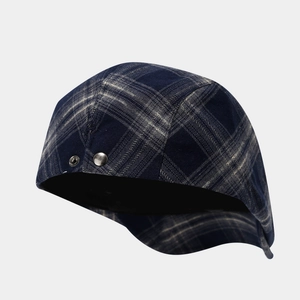 Classic dark blue checkered beret hat with vintage British style and metal rivets