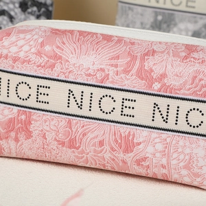 Pink jacquard floral makeup bag with NICE embroidered ribbon and white zipper detail