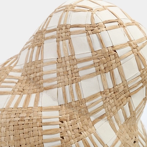 Cross-woven straw sun hat for women featuring beige natural fiber and white ribbon texture