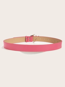 Detail shot of the vintage pink leather belt featuring a crystal buckle and inner lining