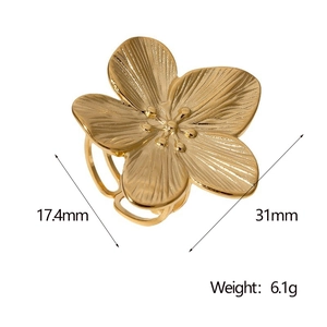 Detail shot of a 31mm gold floral ring showing fine radial texture and dimensions