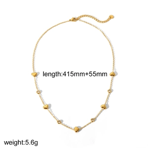 Detail of 18k gold plated stainless steel heart necklace with cubic zirconia stones