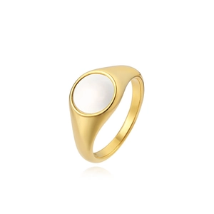 Close-up of minimalist gold signet ring featuring a polished round white shell inlay