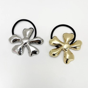 Gold and silver metallic flower hair ties with high elasticity bands on white background