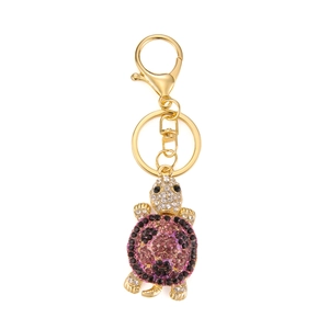 Golden turtle keychain with colorful rhinestones and purple crystals for bags