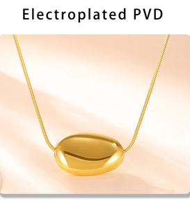 Detailed close-up of a gold-plated bean pendant on a snake chain with PVD coating finish