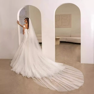 Elegant satin off-shoulder mermaid wedding dress with long pearl veil and cathedral train