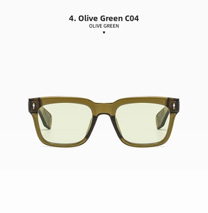Detail of olive green acetate sunglasses frame with iconic silver arrow-shaped rivets