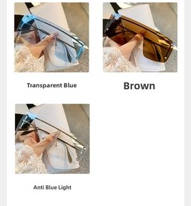 Close-up of oversized rimless metal rivet sunglasses in blue, brown and clear tints