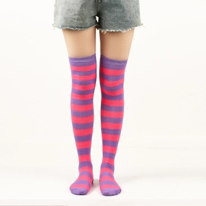 Detail of purple and pink striped over-the-knee socks showing elastic knit texture